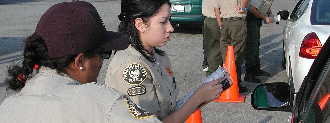 Police explorers helping at a traffic stop.