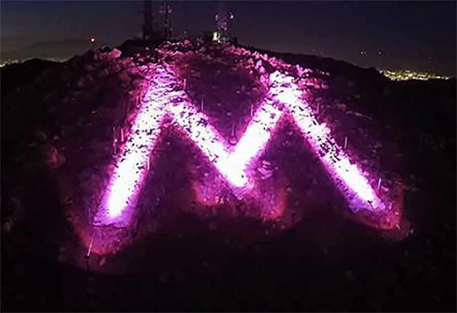 The Moreno Valley "M" lit purple